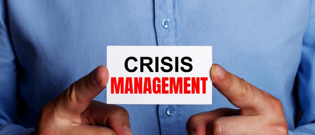 words-crisis-management-is-written-white-business-card-man-s-hands